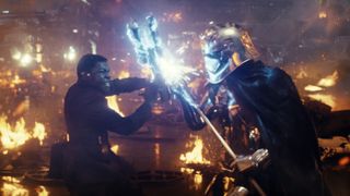 Finn (John Boyega) takes on Captain Phasma (Gwendoline Christie) in an intensive battle that was augmented with background action and reflection enhancement by the visual effects team