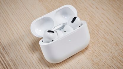 AirPods Pro true wireless earbuds on wooden table
