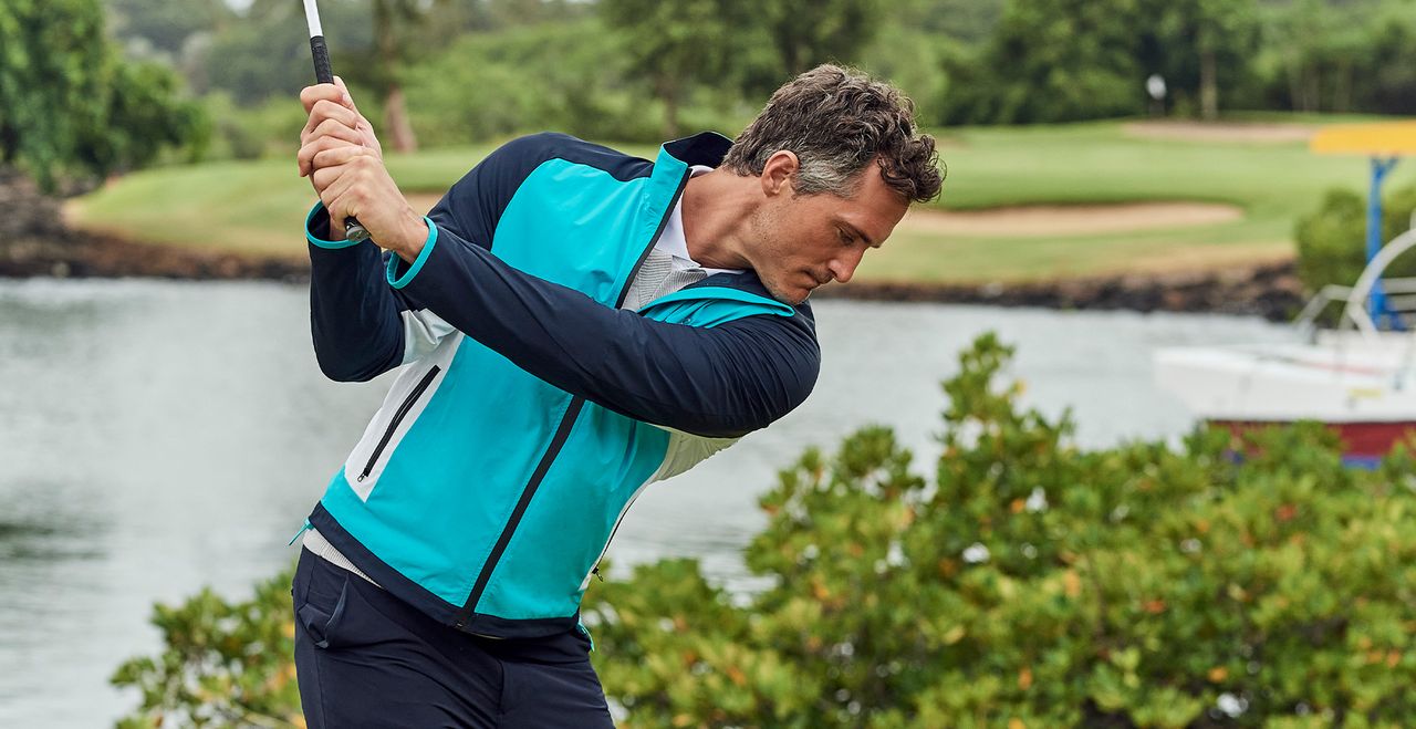 Golfer swings wearing a Crew Clothing jacket
