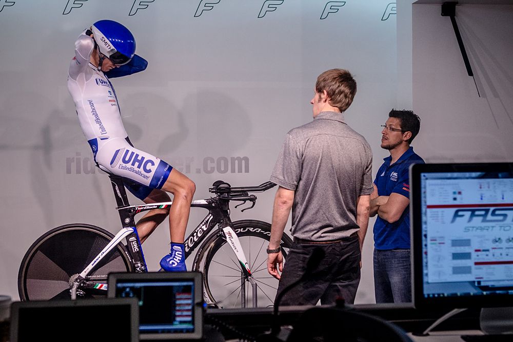 Jani Brajkovic removes his helmet to provide on the bike feedback