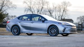 2025 Toyota Camry Hybrid XSE side view.