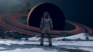 An astronaut staring at a distant ringed planet in Starfield