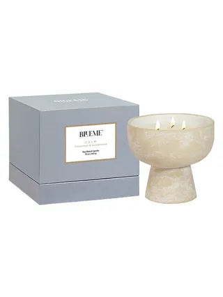 Bleme Calm Osmanthus & Sandalwood Medium Ceramic Candle features a terracotta design inspired by amphoras and light blue packaging.