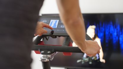 Woman using one of the best exercise bikes at home