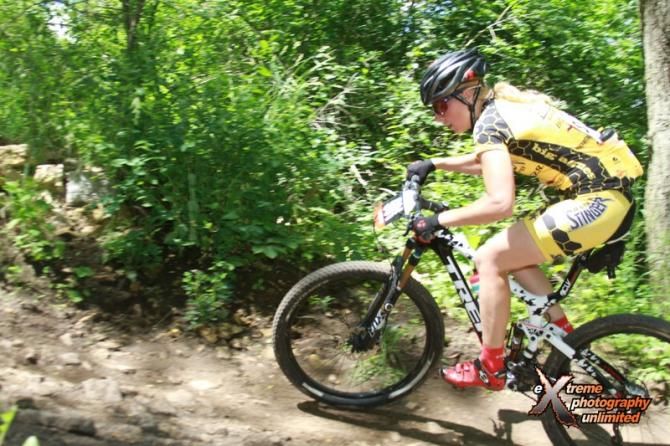 Abby Strigel (Honey Stinger/Bontrager) takes the lead into the woods