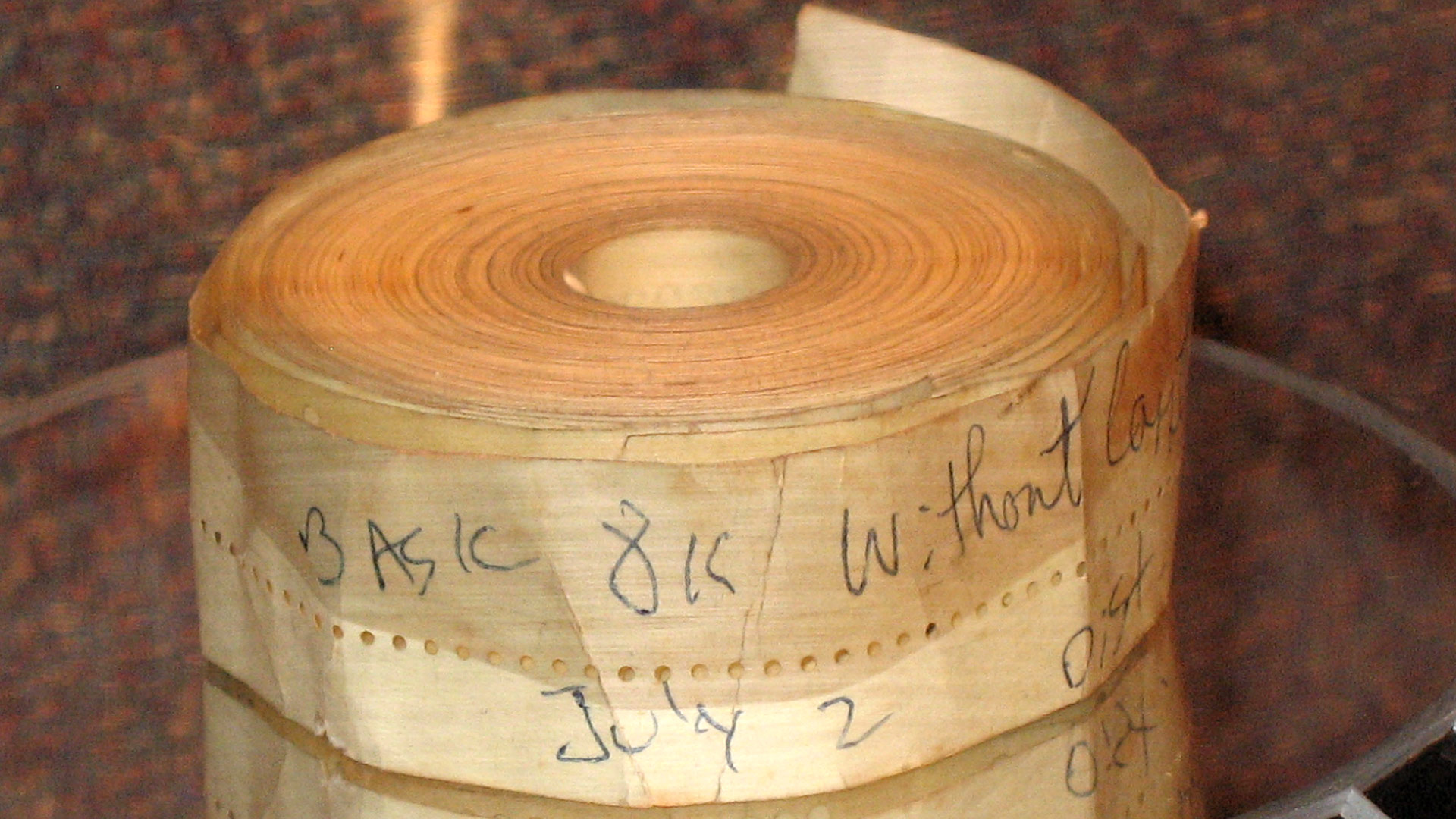 This is an original copy of 8K BASIC on paper tape for the MITS Altair 8800 computer. The BASIC interpreter was written by Bill Gates, Paul Allen, and Monte Davidoff. The tape is labeled "BASIC 8K without cassette" and dated July 2 (1975). 