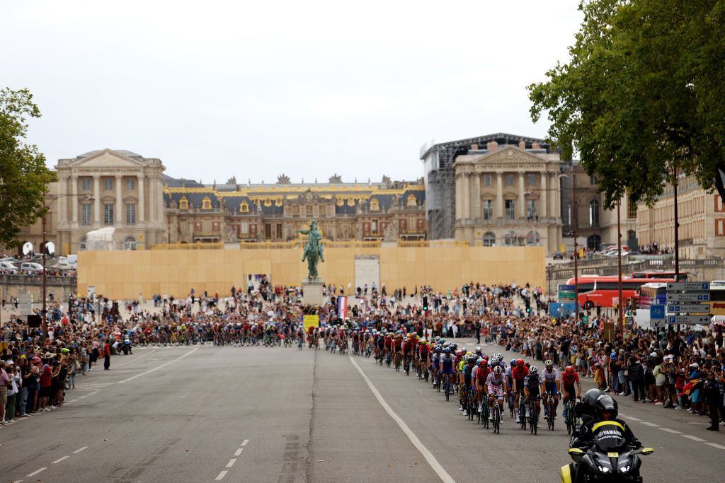 The peloton rides through Versailles Village