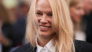 Pamela Anderson is seen outside The Row show wearing a white shirt and black blazer during the Womenswear Spring/Summer 2024 as part of Paris Fashion Week on September 27, 2023 in Paris, France