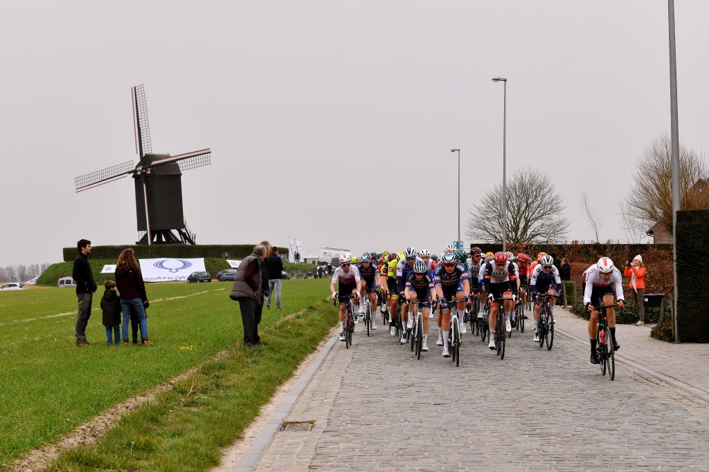 NOKERE BELGIUM MARCH 16 A general view of Max Walscheid of Germany and Team Cofidis and the peloton passing through a landscape during the 76th Danilith Nokere Koerse 2022 Mens Elite a 1898km one day race from Deinze to Nokere NokereKoerse DNK22 on March 16 2022 in Nokere Belgium Photo by Luc ClaessenGetty Images