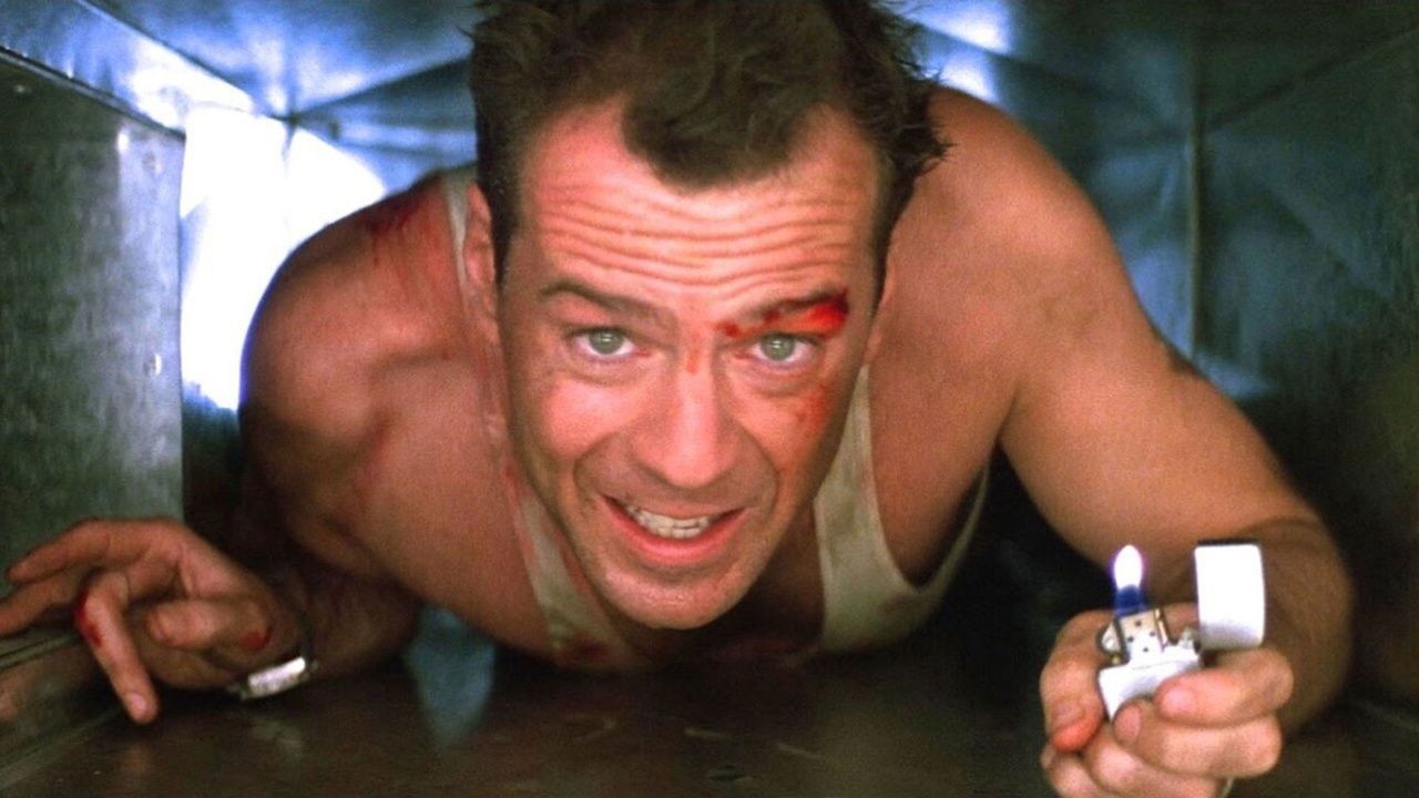 John McClane (Bruce Willis) crawls through and air vent in Die Hard