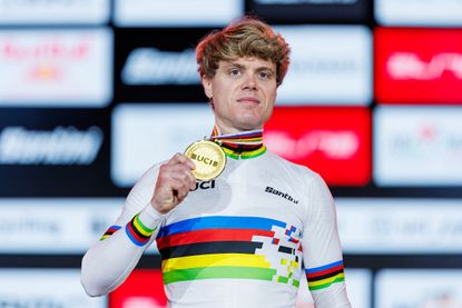 Jason Osborne of Germany celebrates winning gold at the 2024 UCI Cycling Esports World Championships powered by MyWhoosh