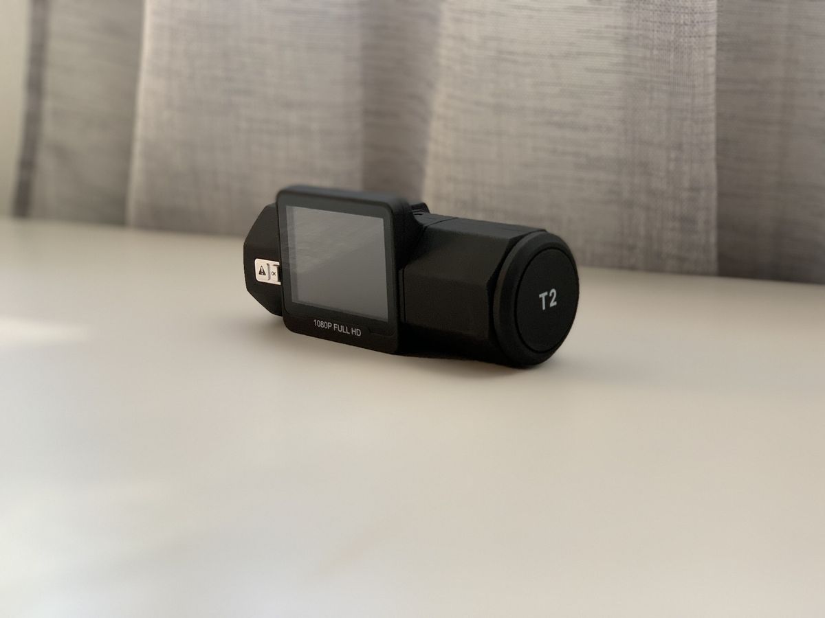 Vantrue T2 Dash Cam detached on table, slightly angled