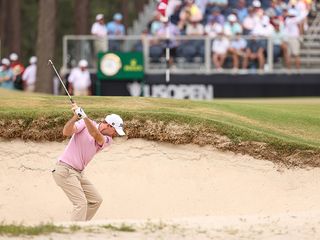 Russell Henley hitting a bunker shot at the US Open 2024
