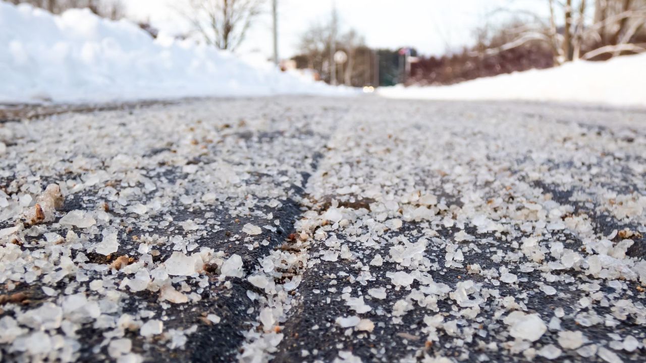 A macro image of rock salt on a road 