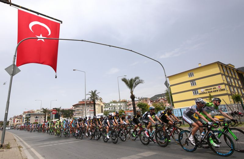 The peloton passes under a Turkish flag on stage one