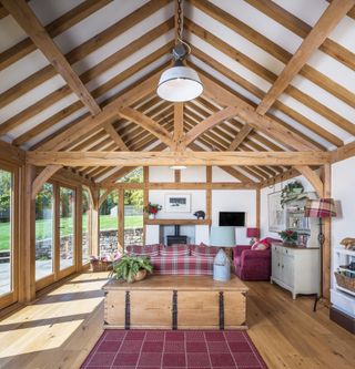 large living room with vaulted oak frame ceiling