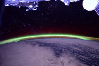 Green auroras dance over Earth in this photo by NASA astronaut Terry Virts captured on June 10, his last full day in space before landing on a Soyuz spacecraft on June 11, 2015.