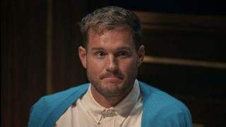 Colton Underwood in his blue sweater at the Round Table