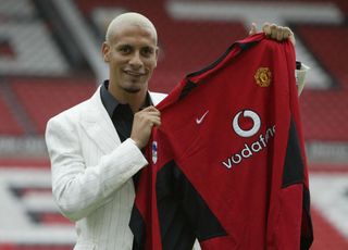 MANCHESTER - JULY 22: Manchester United's new signing Rio Ferdinand shows off his new shirt at a press conference at Old Trafford, Manchester, England on July 22, 2002. (Photo by Alex Livesey/Getty Images)