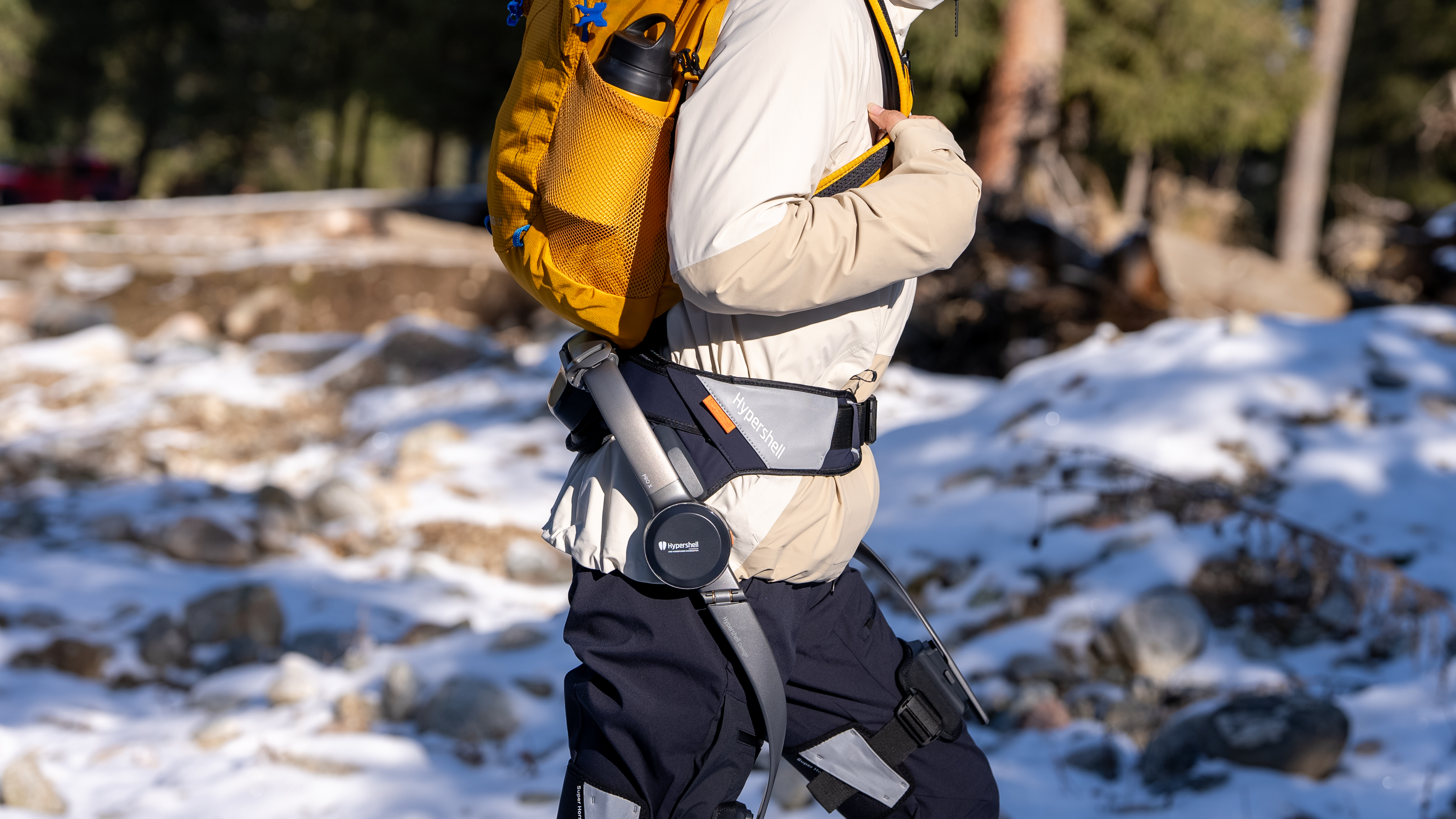 Close up of woman hiking in the snow wearing the Hypershell Exoskeleton