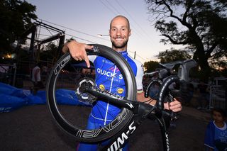 Tom Boonen points to the disc brakes on his bike