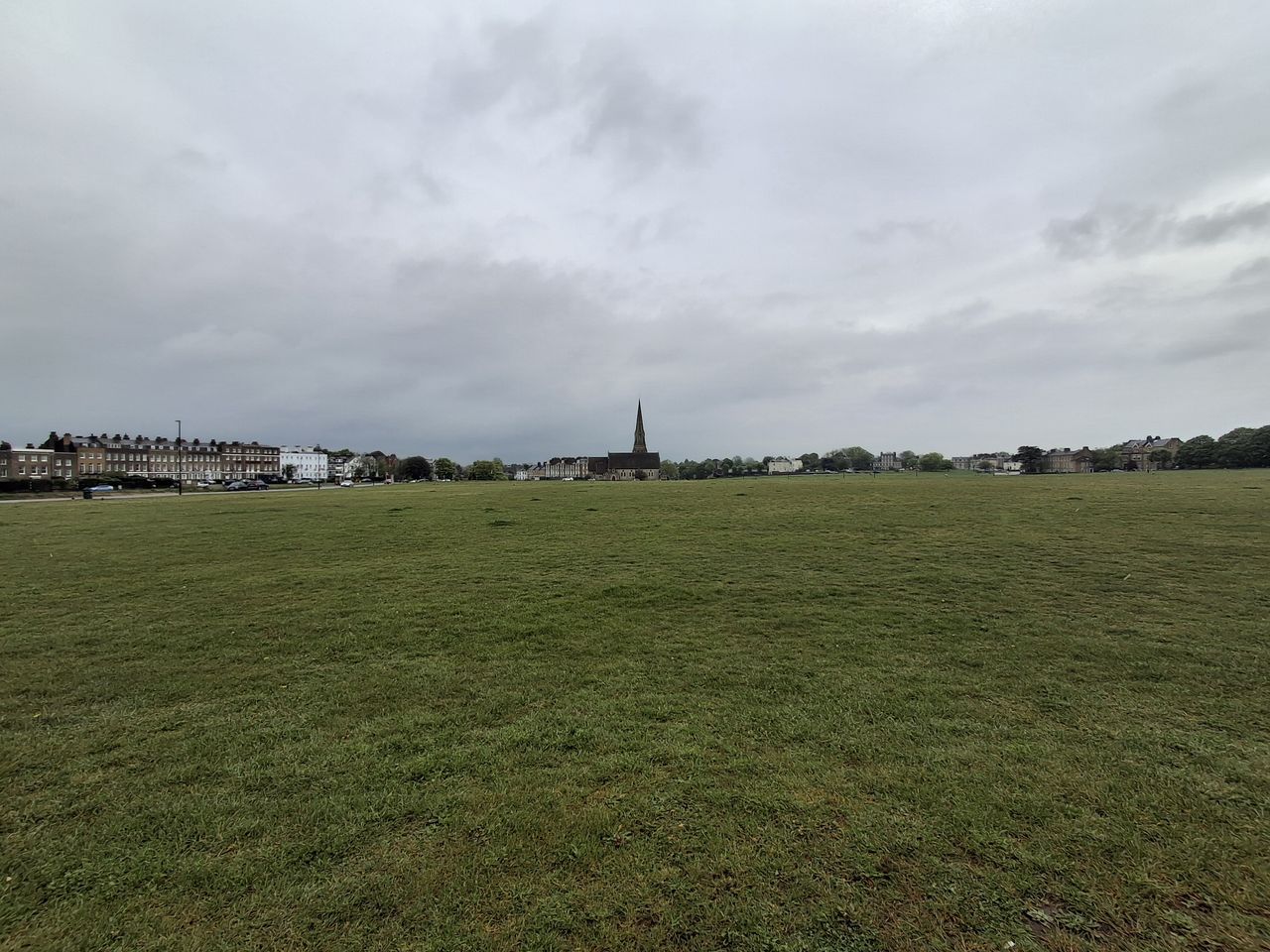 A field with a church taken on the Samsung Galaxy A35