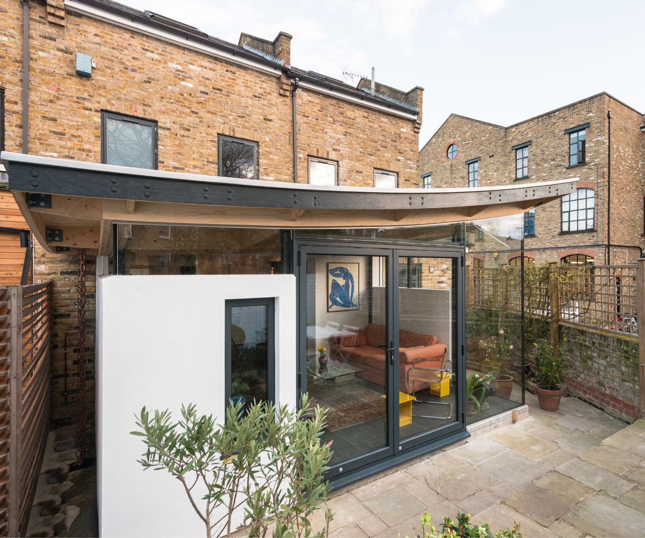 timber frame extension with wing roof, aluminium glazing, external rendered wall