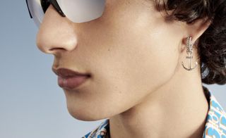 Man in Dior sunglasses and Dior-print shirt