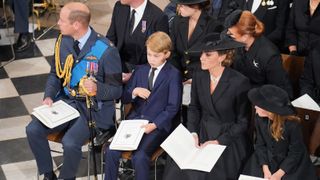 Prince William, Prince of Wales, Prince George of Wales, Catherine, Princess of Wales, Princess Charlotte of Wales and (second row) Jack Brooksbank, Princess Eugenie and Sarah, Duchess of York on September 19, 2022 in London, England.
