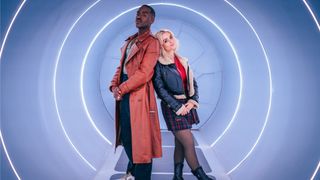 The Doctor (Ncuti Gatwa) and Ruby Sunday (Millie Gibson) photographed standing back-to-back inside the TARDIS in Doctor Who season 14