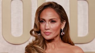Jennifer Lopez is pictured with a curly, side-swept hairstyle whilst arriving for the 81st annual Golden Globe Awards at The Beverly Hilton hotel in Beverly Hills, California, on January 7, 2024.