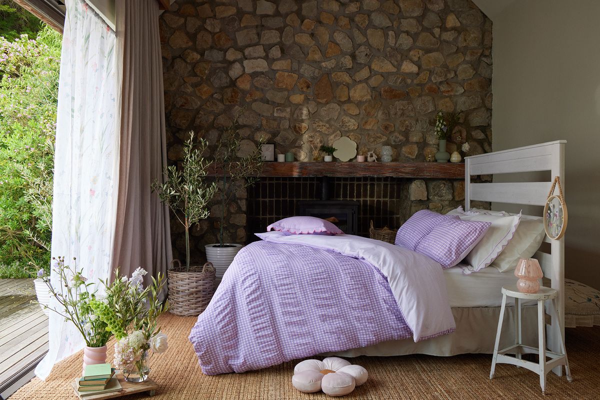 Cottage bedroom with doors open lilac gingham bedding 