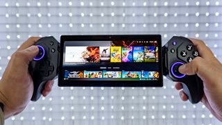 A person holding up the Elo Vagabond mobile game controller while accessing their Steam library using the Steam Link app