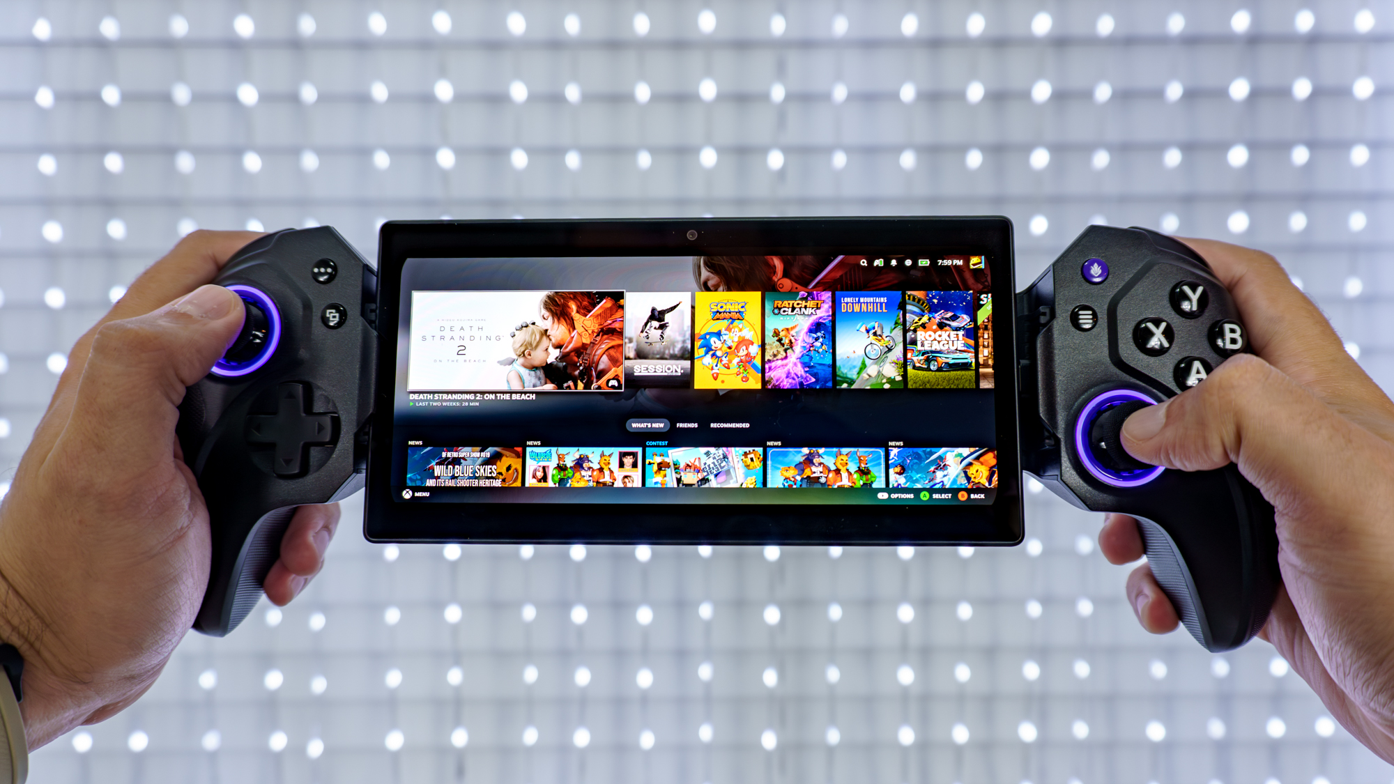 A person holding up the Elo Vagabond mobile game controller while accessing their Steam library using the Steam Link app
