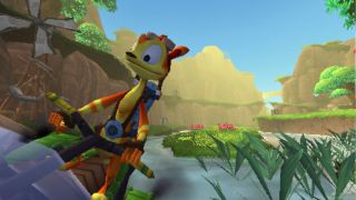 Daxter rides a jetbike in his own PSP game, gliding past a windmill