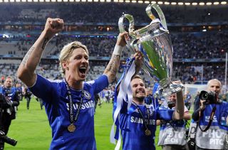 Fernando Torres and Juan Mata celebrate with the Champions League trophy after Chelsea's win on penalties against Bayern Munich at the Allianz Arena in the 2012 Champions League final.