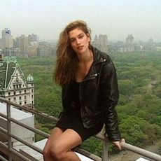 Woman Sitting on Railing