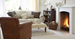 neutral living room with brown leather chair