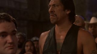 Danny Trejo looking tough, wearing a vest in From Dusk Till Dawn