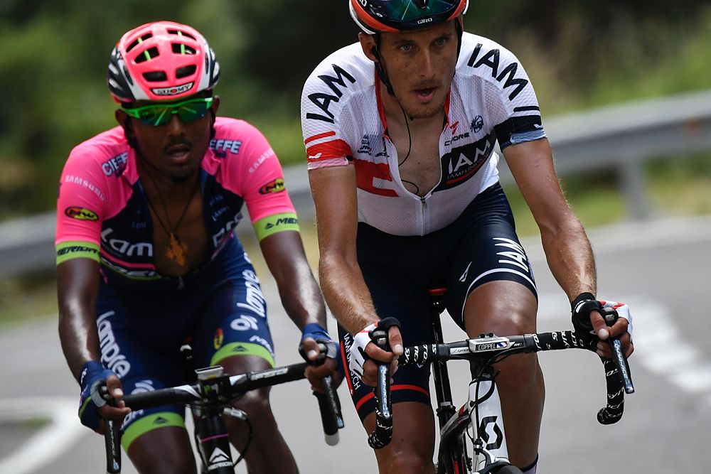France's Jerome Coppel (R) and Ethiopia's Tsgabu Grmay (L) ride during the 184,5 km ninth stage of the 103rd edition of the Tour de France cycling race on July 10, 2016 between Vielha Val d'Aran and Andorre Arcalis