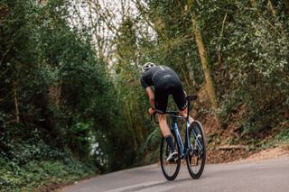 Male cyclist riding hard to improve his vo2 max