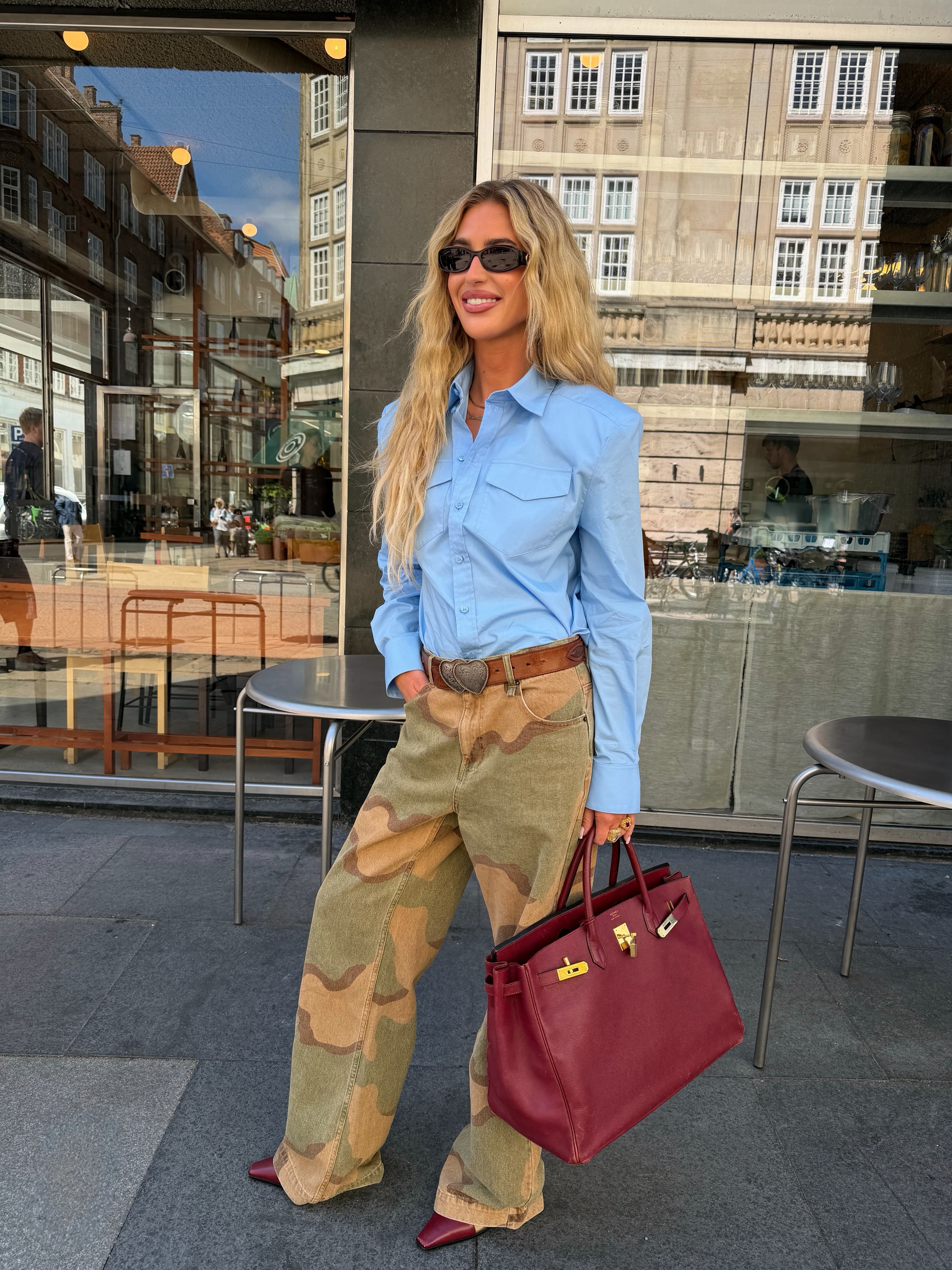 Influencer wearing button-down shirt outfit.