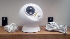 Photo of the BlissLights Evolve with the wall plug and USB cable