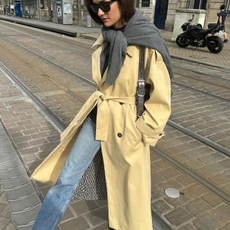 Fashion person Anne Laure-Mais wears a blue skinny jeans outfit