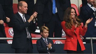 Prince William, Duke of Cambridge, Prince George of Cambridge, and Catherine, Duchess of Cambridge, celebrate the first goal in the UEFA EURO 2020 round of 16