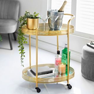 Drinks trolley with ice bucket and cocktail glasses
