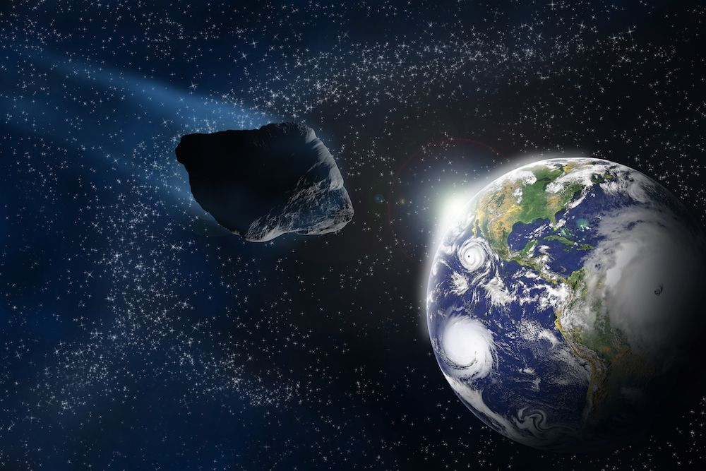 asteroid approaches earth from space