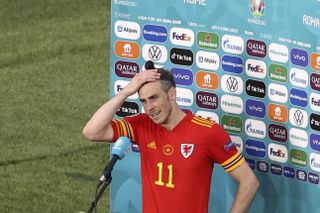 Gareth Bale cannot hide his relief in his post-match interview after 10-man Wales held on to second place in Group A