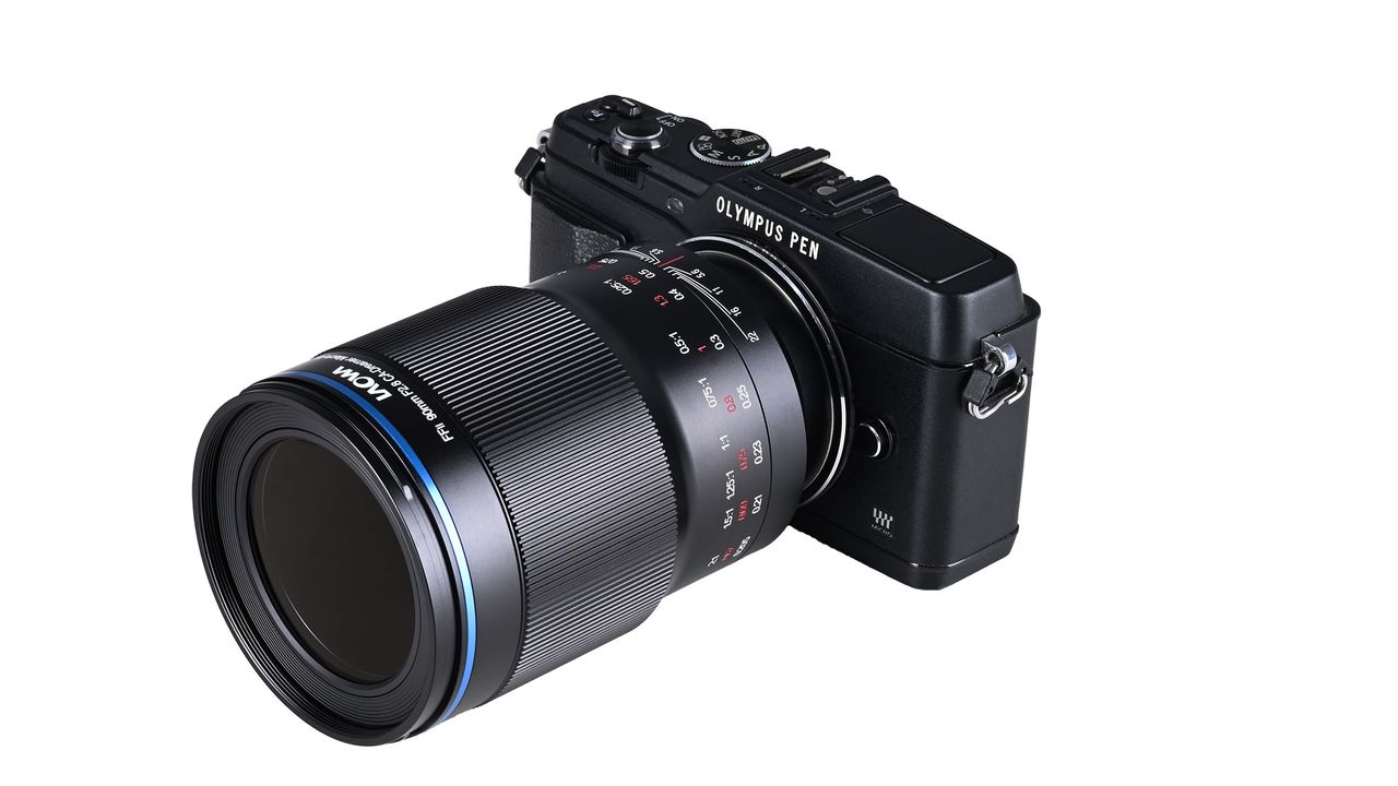 A black Laowa digital camera lens attached to an Olympus camera.