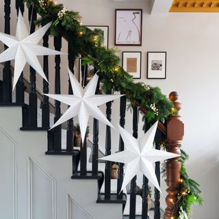 Christmas star decorations and staircase garland